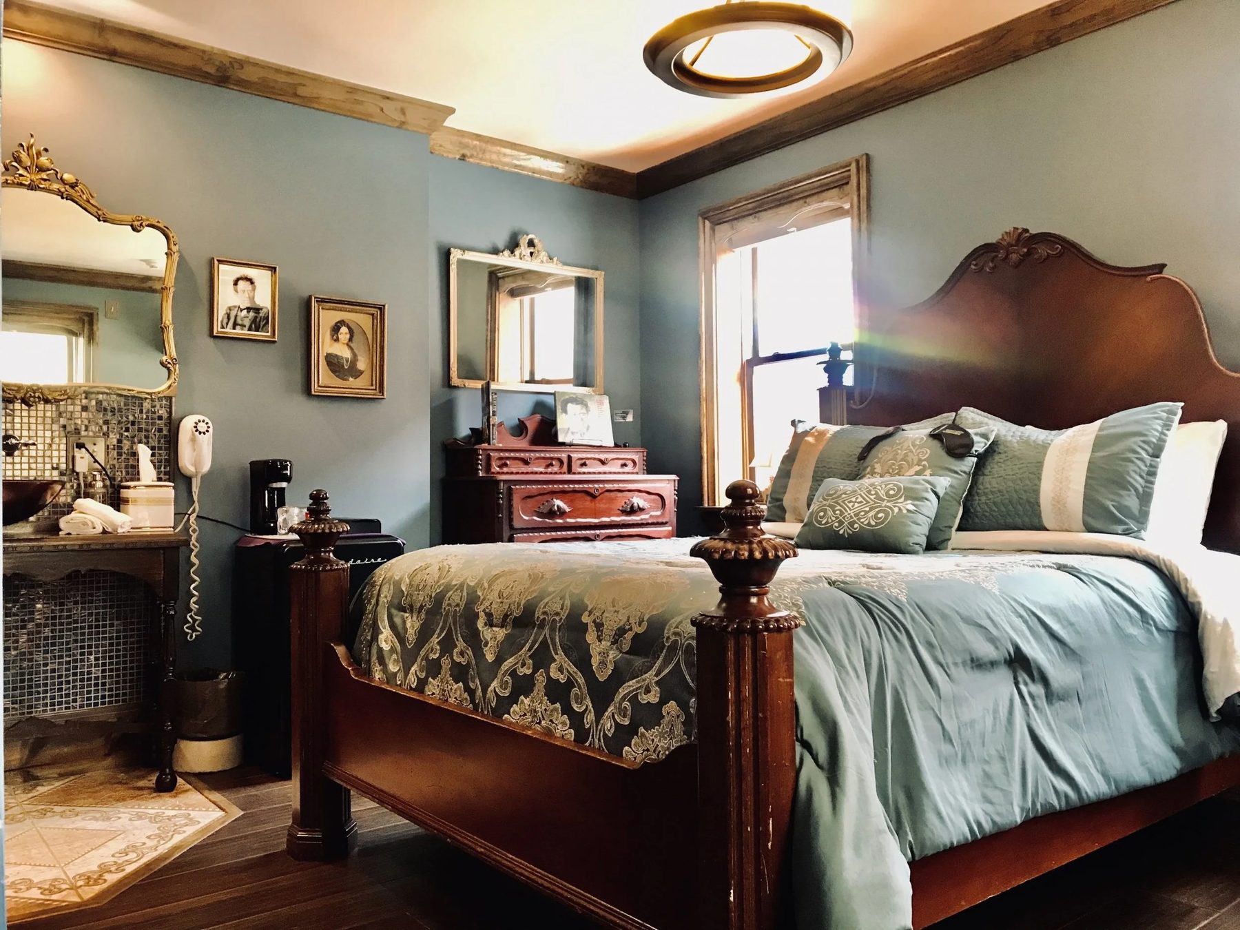The Mahler Room, furnished in dark woods and hues of blue